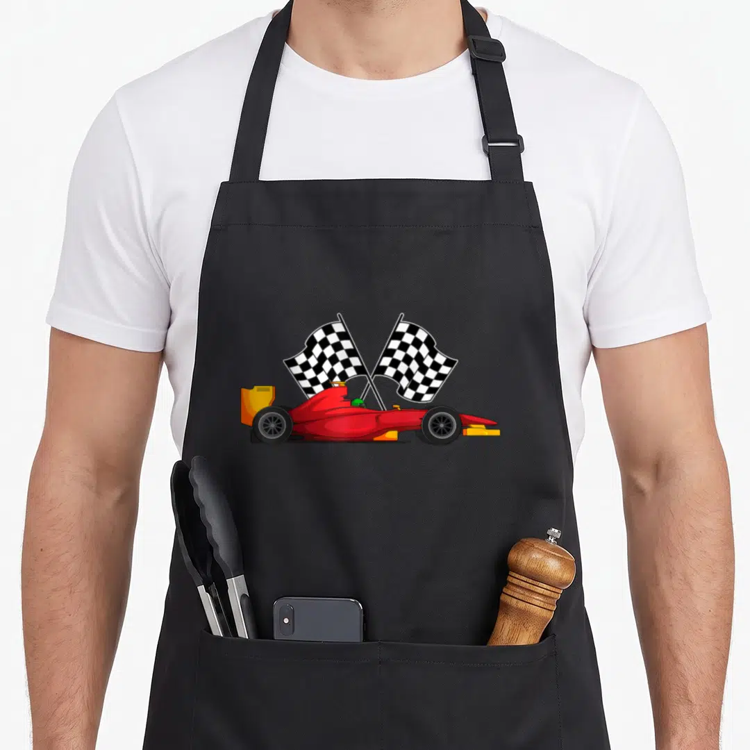 Racing automobile car apron - Red race car with two crossed black and white checkered flags in cartoon style — shown on a black cotton canvas apron against a white background
