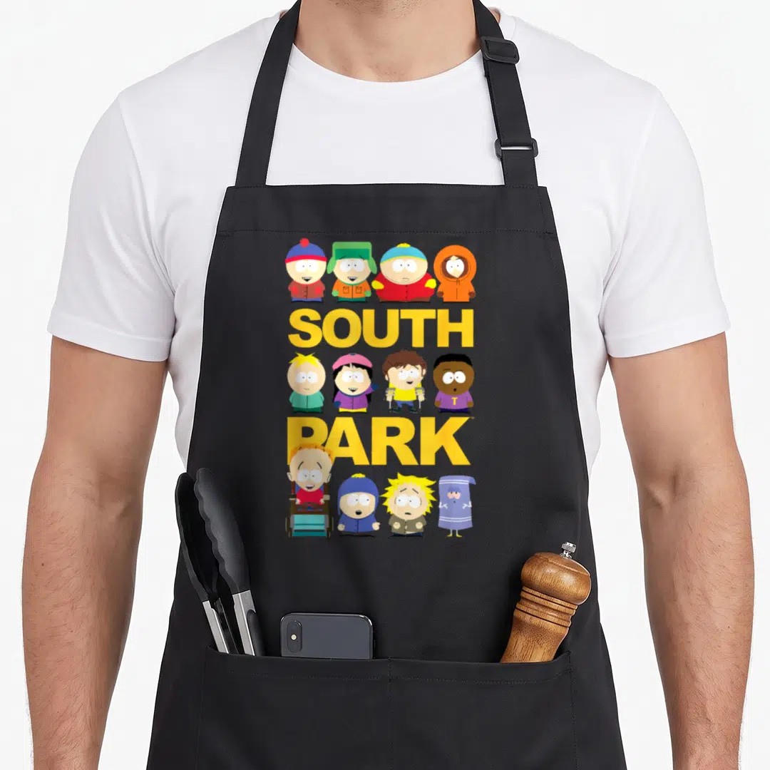 Jumbo south apron - Yellow SOUTH PARK text with twelve cartoon characters in yellow blue red green orange — shown on a black cotton canvas apron against a white background