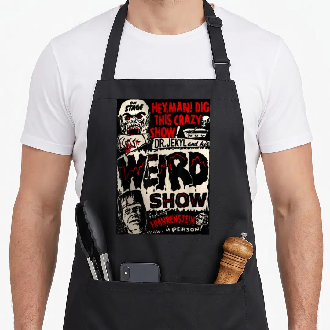 Frankenstein horror movie apron - Vintage horror poster design with monster heads and distressed text reading Weird — shown on a black cotton canvas apron against a white background
