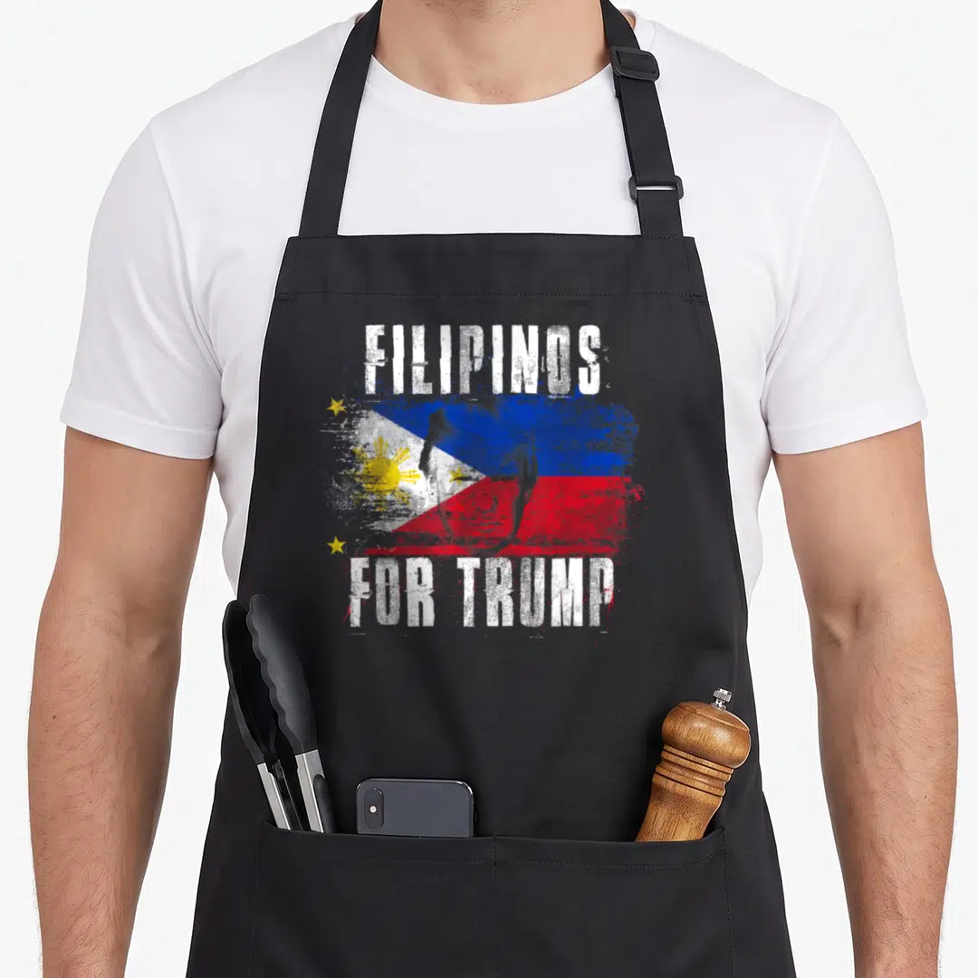 Filipino patriotic apron - Distressed FILIPINOS FOR TRUMP text over Philippine flag with Trump face overlay in white — shown on a black cotton canvas apron against a white background