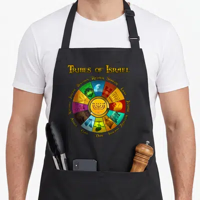 Tribe israel apron - Menorah surrounded by 12 colored wedges with tribal names Reuben, Simeon, Levi, Judah, Zebulun — shown on a black cotton canvas apron against a white background