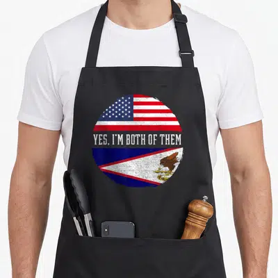 Samoan samoa american flag apron - Circular split US and American Samoan flag with Yes Im Both Of Them text — shown on a black cotton canvas apron against a white background