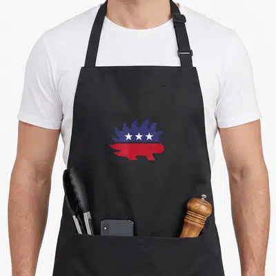 Libertarian liberty apron - Blue and red hedgehog silhouette with three white stars in minimalist style — shown on a black cotton canvas apron against a white background