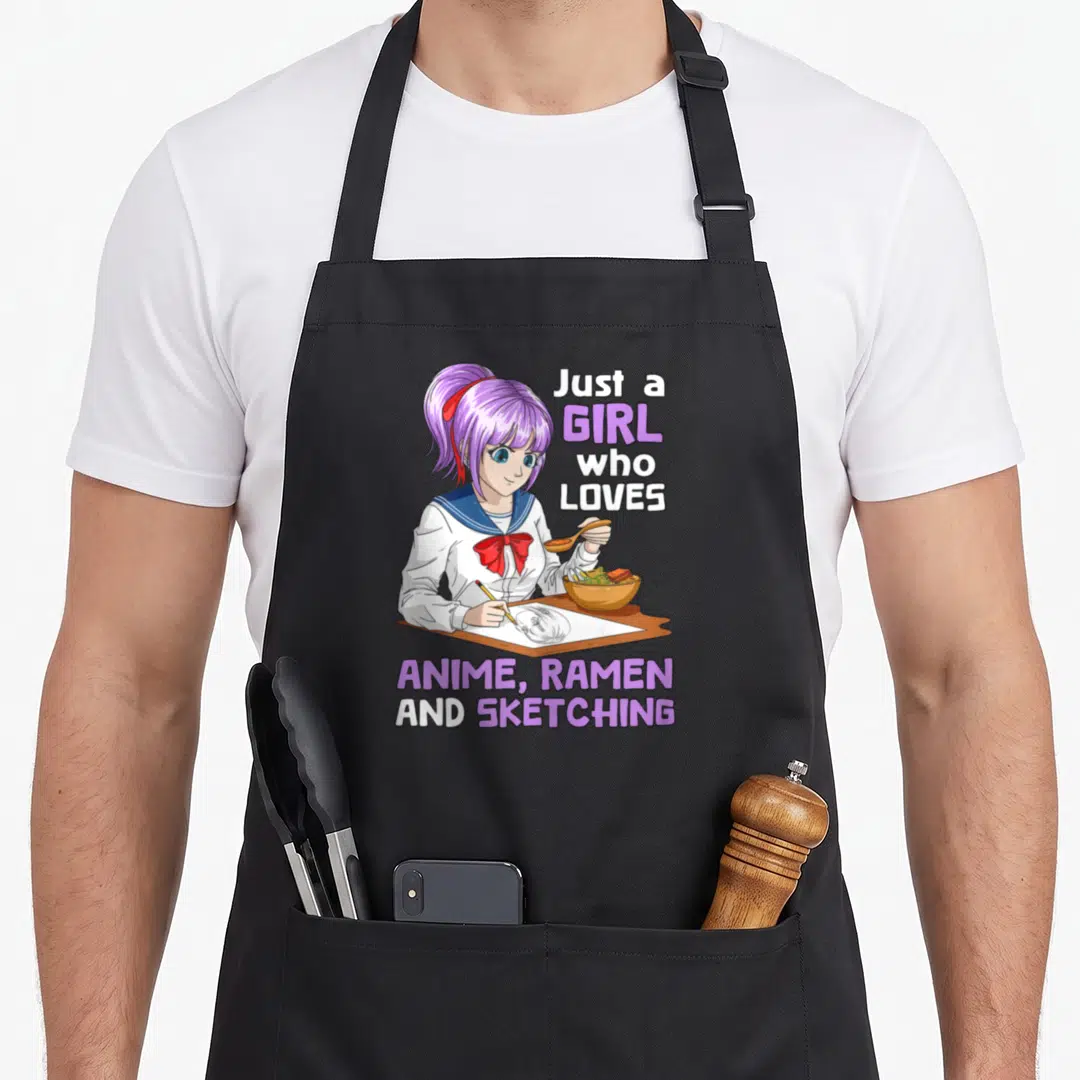 Anime ramen sketching japan apron - Purple hair girl eating ramen and sketching with text Just a Girl Who Loves Anime — shown on a black cotton canvas apron against a white background