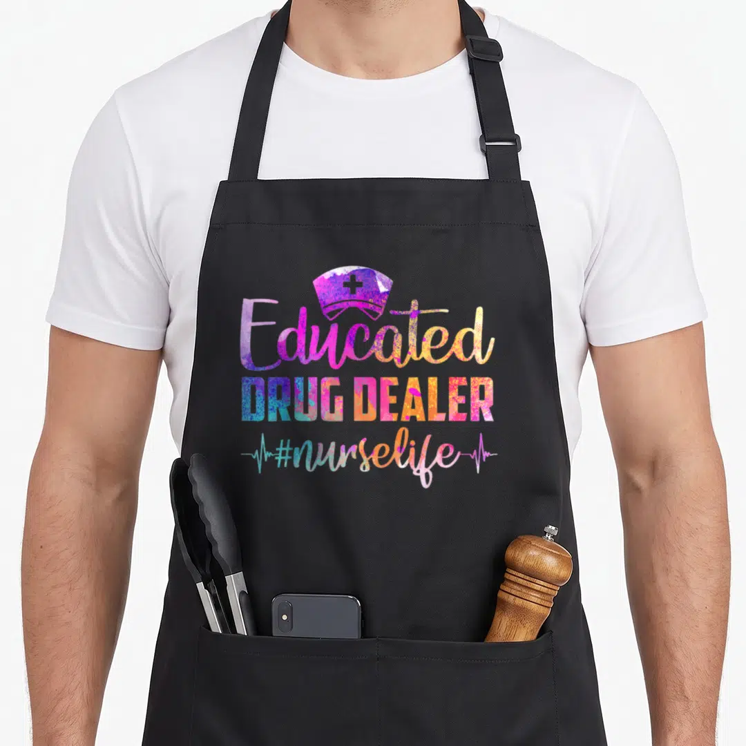 Dealer nurse apron - Colorful nurse hat above 'Educated DRUG DEALER' text and heartbeat line — shown on a black cotton canvas apron against a white background