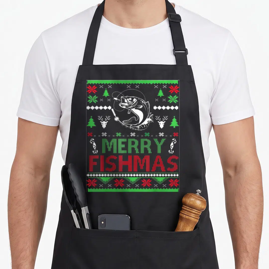 Fishing ugly christmas apron - Retro bass fish and Merry Fishmas text in red green white knit sweater pattern style — shown on a black cotton canvas apron against a white background