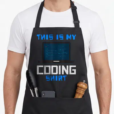 Coding nerd apron - Laptop graphic with binary filled text reading THIS IS MY CODING SHIRT — shown on a black cotton canvas apron against a white background