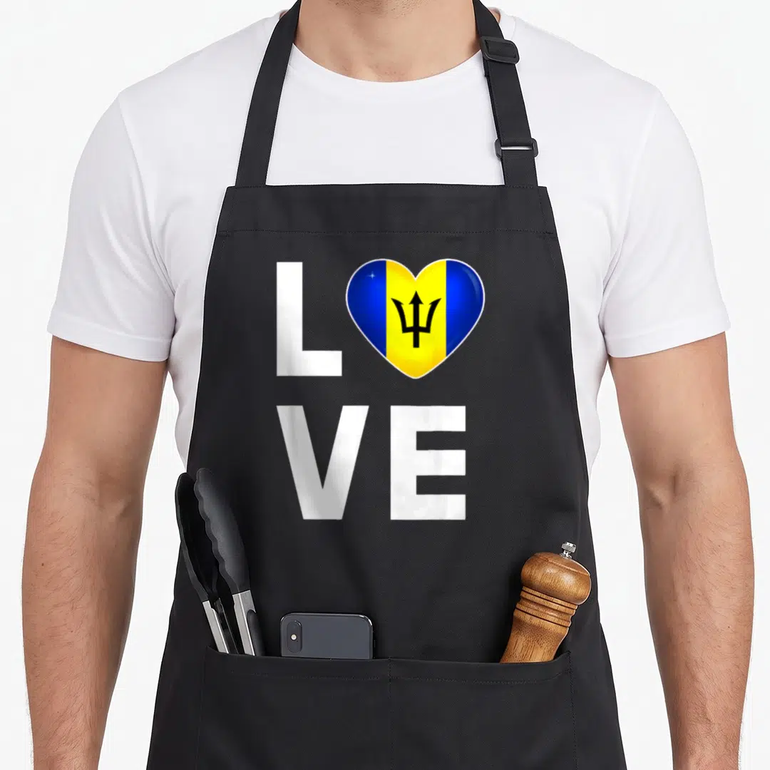 Barbado flag barbadian apron - LOVE text with heart containing blue yellow black trident flag on black background — shown on a black cotton canvas apron against a white background