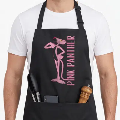 Portrait panther apron - Pink panther character standing left with vertical pink text right, cartoon style — shown on a black cotton canvas apron against a white background
