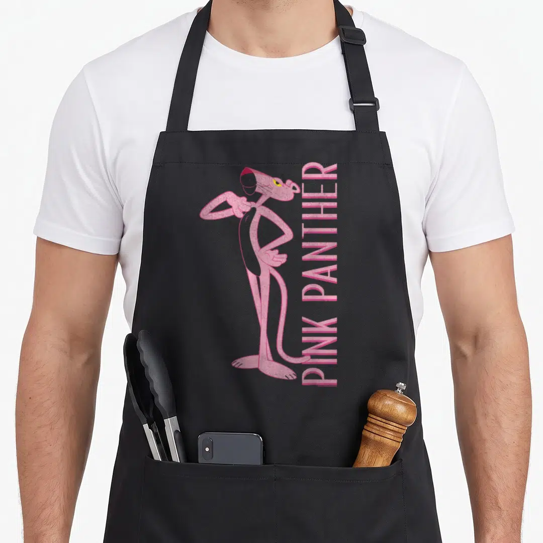 Portrait panther apron - Pink panther character standing left with vertical pink text right, cartoon style — shown on a black cotton canvas apron against a white background