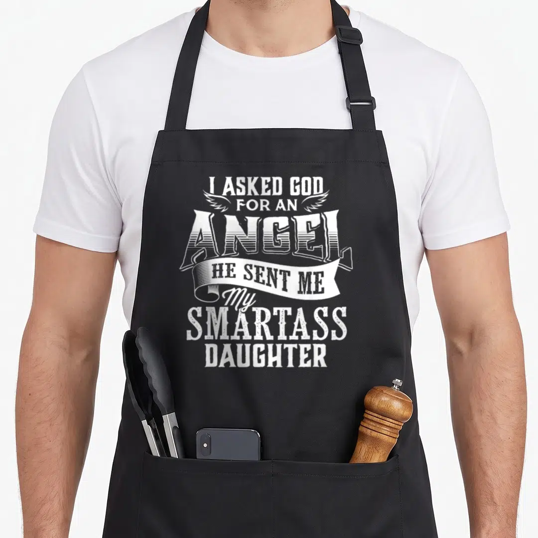 Asked mom daughter apron - White stacked text reading I Asked God For An Angel He Sent Me My Smartass Daughter — shown on a black cotton canvas apron against a white background