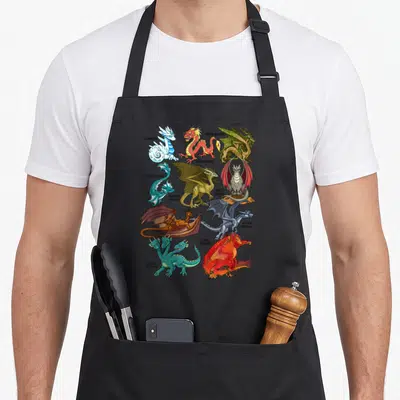 Dragon apron for dad - Nine labeled dragons including ice, fire, and hydra in cartoon style with red, blue, green — shown on a black cotton canvas apron against a white background