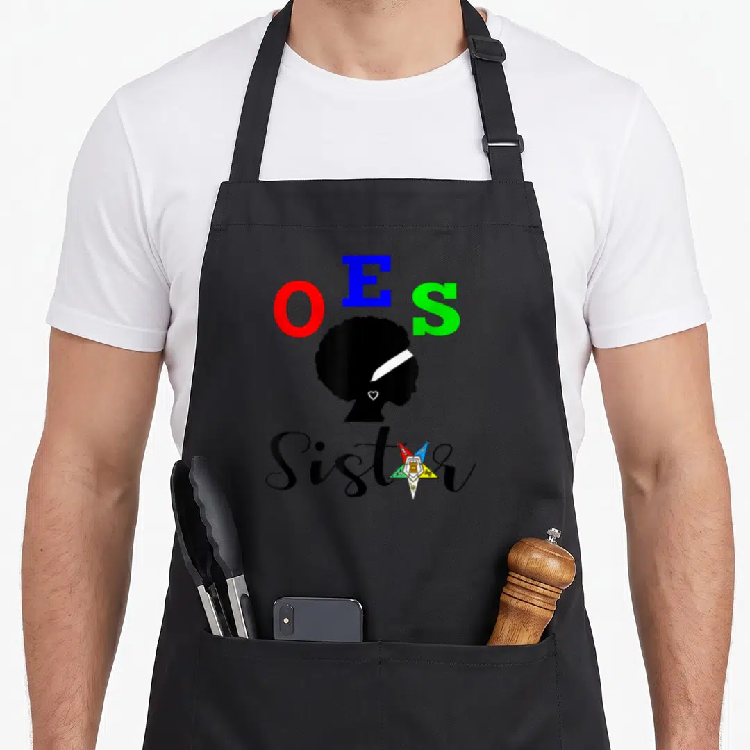 Sistar oes apron - OES letters above black woman silhouette with multicolored star and Sister text — shown on a black cotton canvas apron against a white background