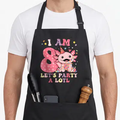 Alotl birthday apron - Pink cartoon axolotl with number 8 and I AM 8 LETS PARTY A LOTL text — shown on a black cotton canvas apron against a white background