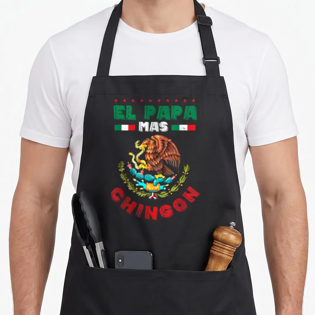 Father papa apron - Eagle on cactus with EL PAPA MAS CHINGON text and six stars in green white red and brown — shown on a black cotton canvas apron against a white background