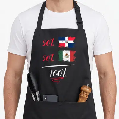 Dominican heritage mexican apron - 50% Dominican flag 50% Mexican flag 100% text in distressed red white blue green — shown on a black cotton canvas apron against a white background