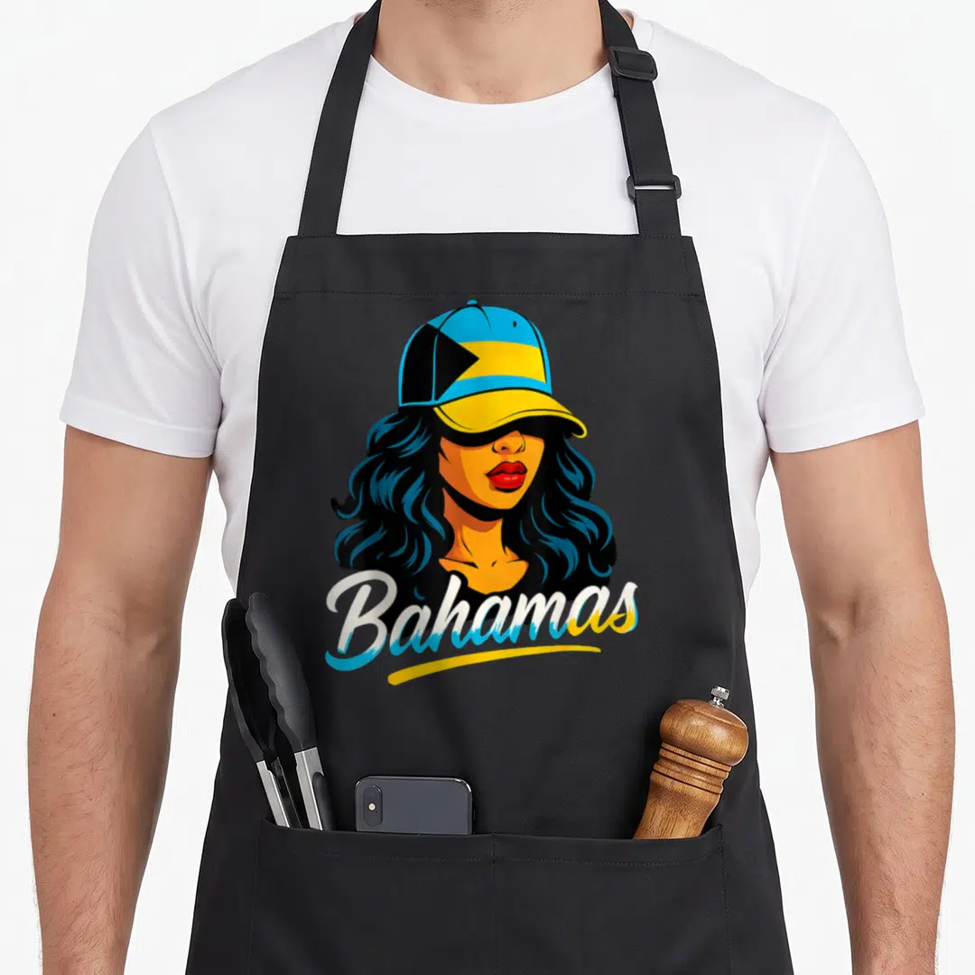 Funny bahamas bahamian apron - Cartoon woman in blue yellow and black cap with Bahamas script text — shown on a black cotton canvas apron against a white background
