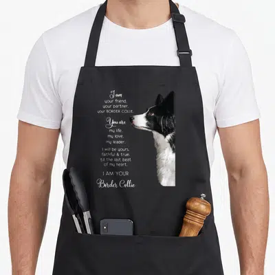 Friend border collie apron - White text reading I am your friend next to a black and white photo of a Border Collie — shown on a black cotton canvas apron against a white background