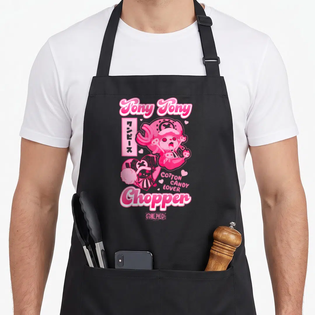 Chopper anime apron - Tony Tony Chopper holding cotton candy with Japanese text and pink hearts — shown on a black cotton canvas apron against a white background