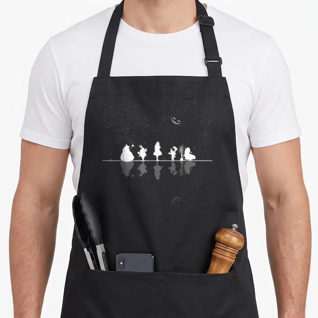 Wonderland starry night apron - Five white character silhouettes on a line with a reflection and floating eyes — shown on a black cotton canvas apron against a white background