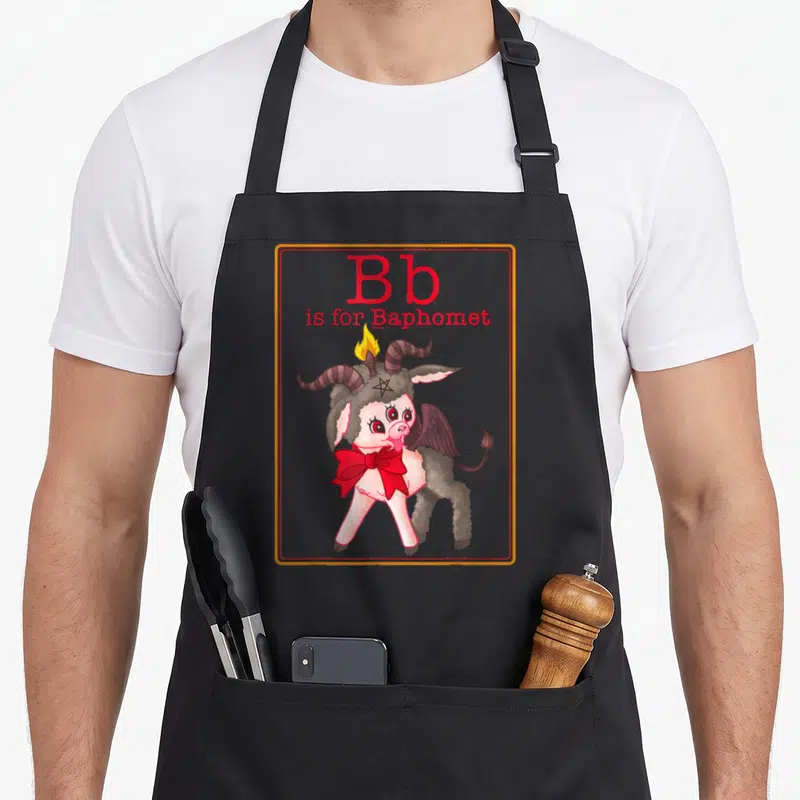 Letter game aprons - Cartoon Baphomet with red bow and Bb is for Baphomet text — shown on a black cotton canvas apron against a white background