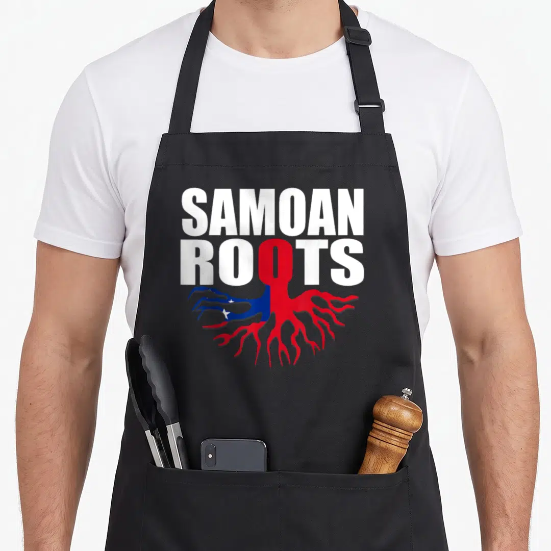 Samoa pride apron - SAMOAN ROOTS text with red blue white roots shaped like flag, white lettering on black — shown on a black cotton canvas apron against a white background