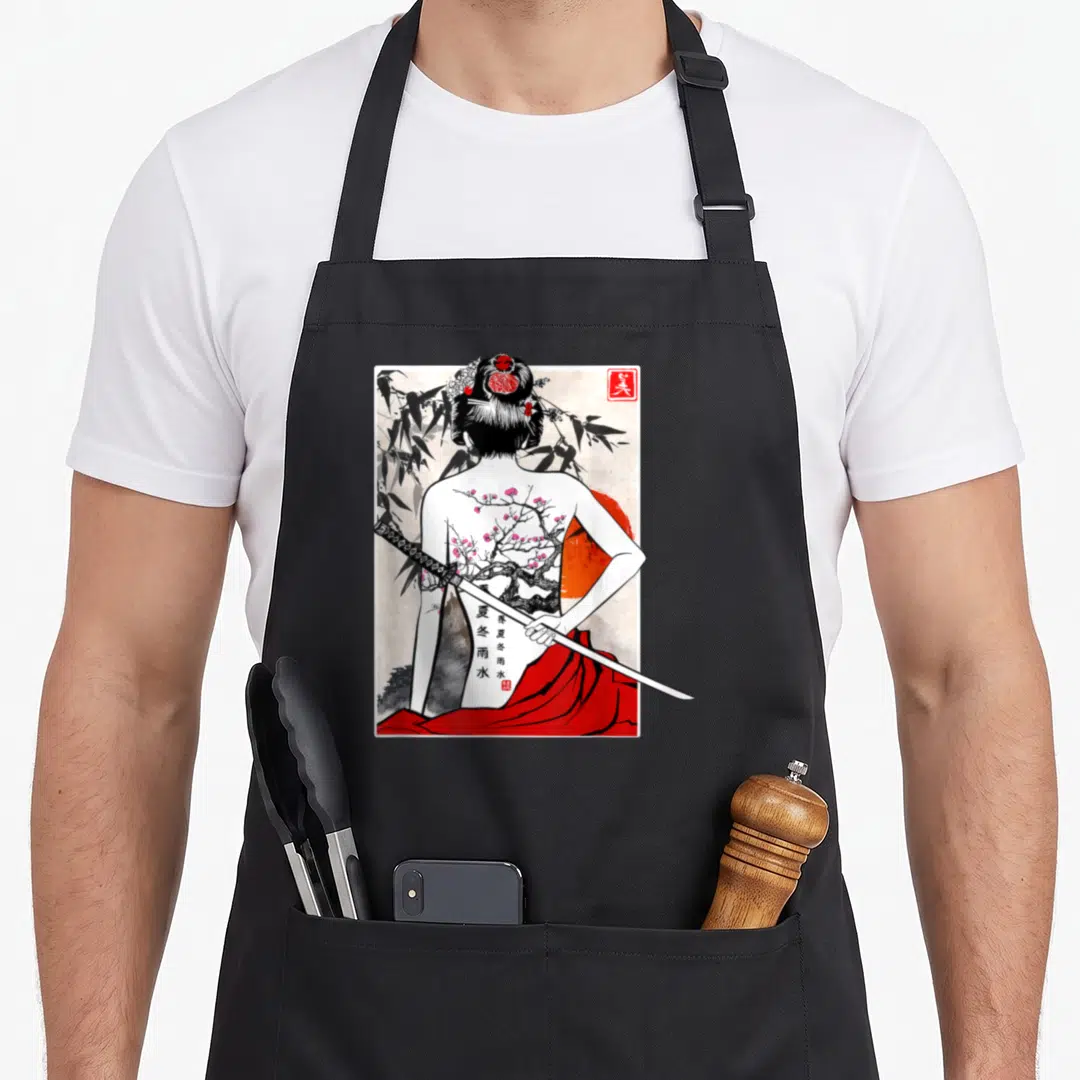 Samurai cherry apron - Woman back view katana cherry blossom tattoo red sun bamboo Kanji line-art — shown on a black cotton canvas apron against a white background