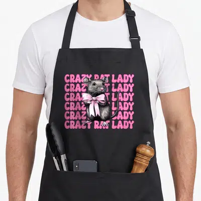 Rat mouse coquette mother's day aprons - Cartoon grey rat holding pink bow over six lines of pink text reading CRAZY — shown on a black cotton canvas apron against a white background
