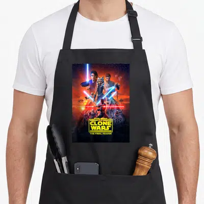 Final wars classic apron - Ahsoka Tano pyramid group Star Wars Clone Wars Final Season yellow logo space background — shown on a black cotton canvas apron against a white background