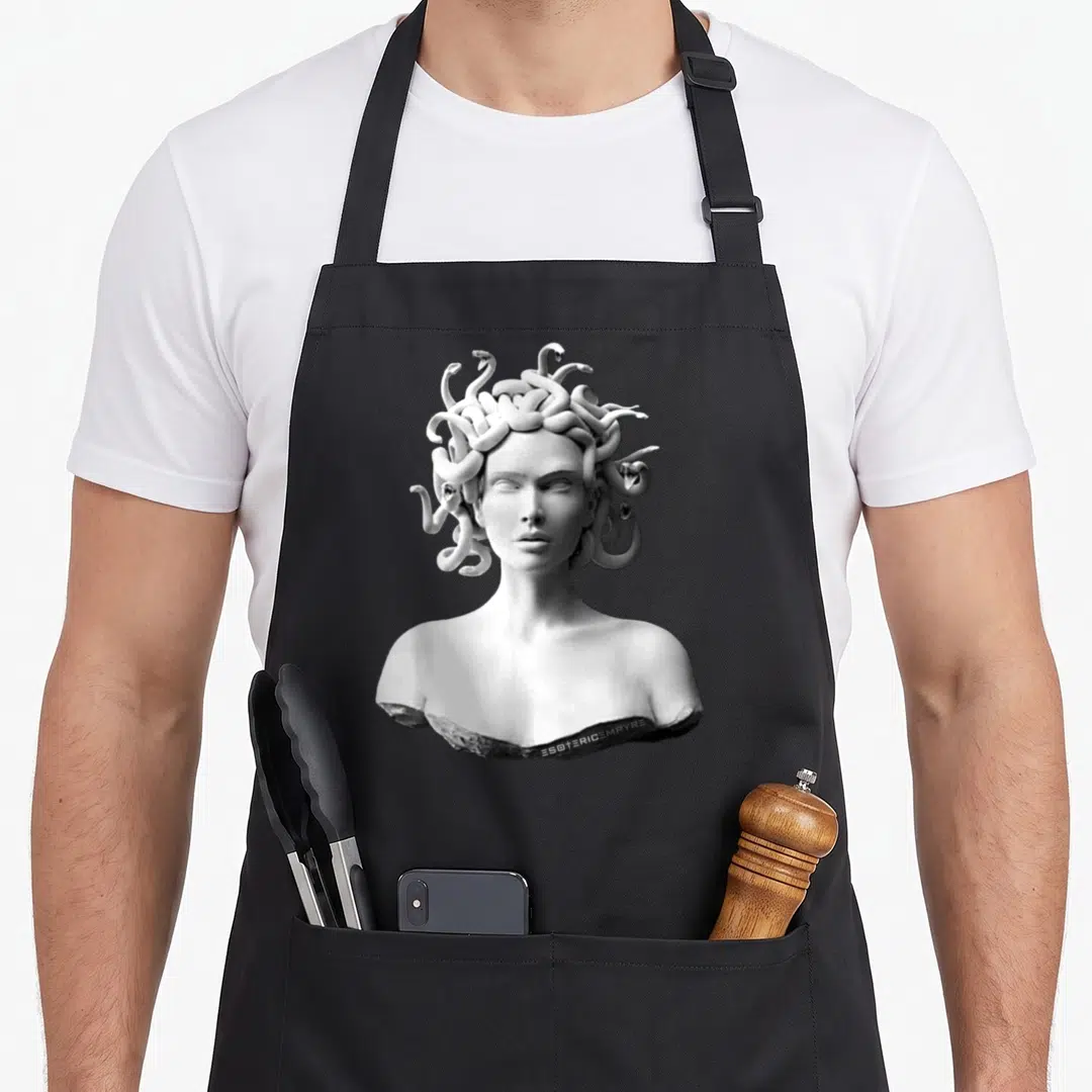 Mythology greek aprons - Realistic white and grey bust of Medusa with snakes for hair centered on grey background — shown on a black cotton canvas apron against a white background