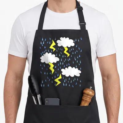 Rainy thunder apron - Three white clouds with yellow lightning and blue raindrops in minimalist style — shown on a black cotton canvas apron against a white background