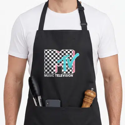 Neon distressed apron - MTV checkerboard logo with cyan TV and MUSIC TELEVISION text in distressed white, cyan, and pink — shown on a black cotton canvas apron against a white background