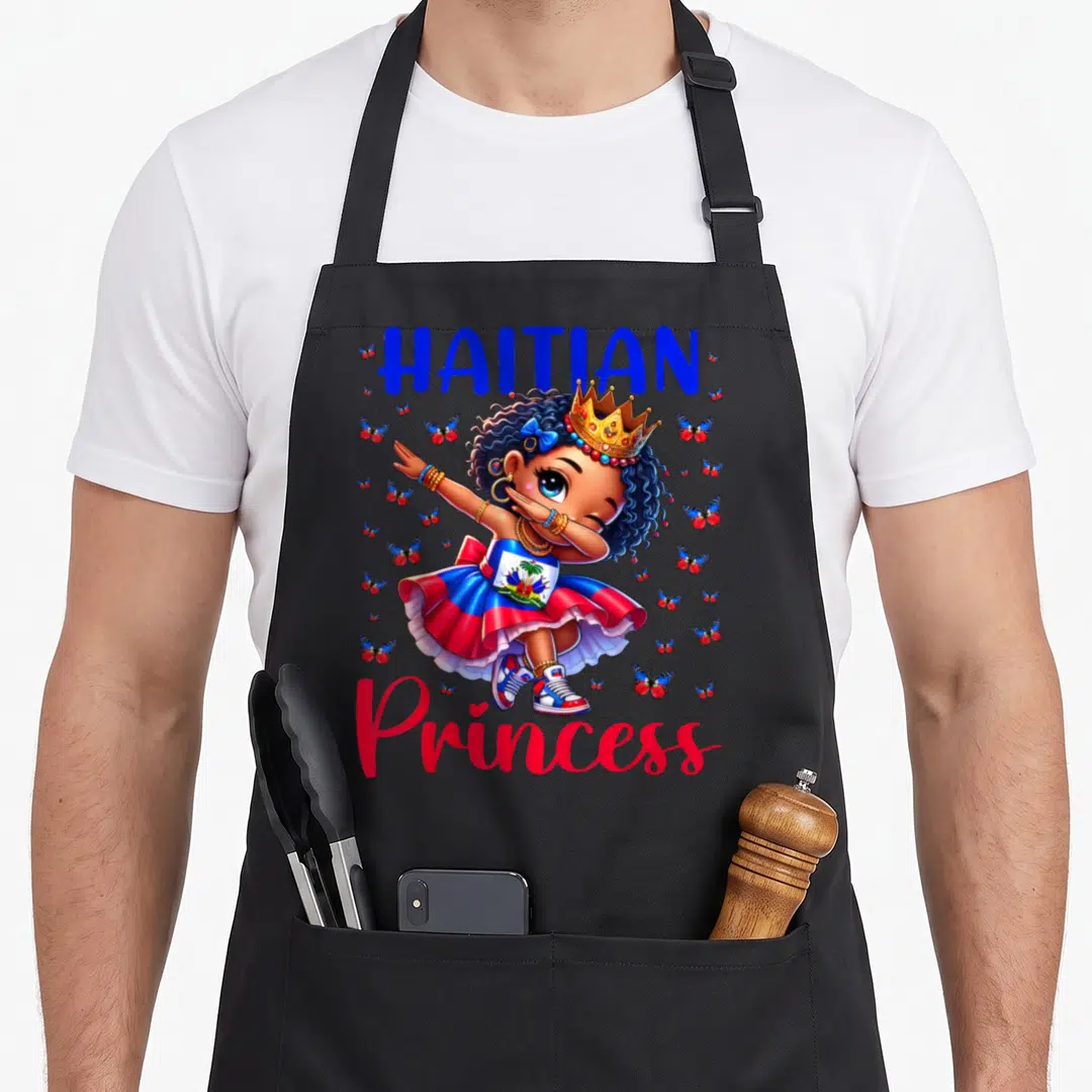 Haitian dabbing princess apron - Cartoon girl dabbing in flag skirt surrounded by butterflies with HAITIAN Princess text — shown on a black cotton canvas apron against a white background
