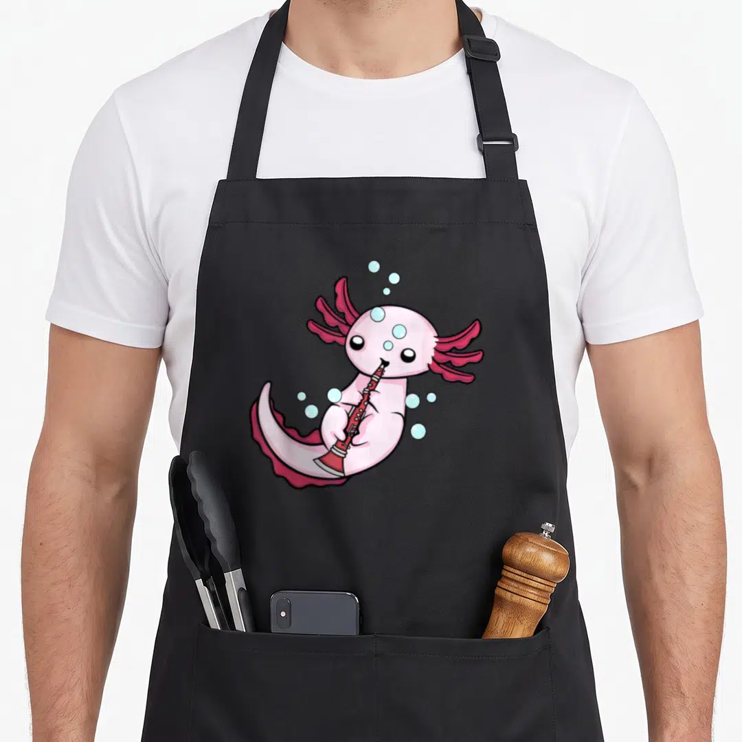 Clarinet band lover apron - Pink axolotl playing red clarinet with light blue bubbles in cartoon art style — shown on a black cotton canvas apron against a white background