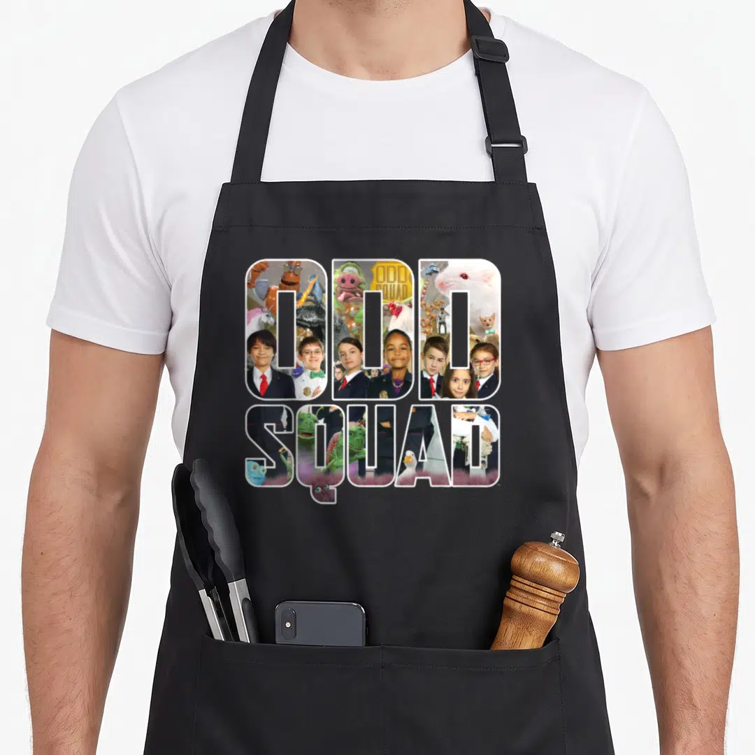 Odd block & apron - ODD SQUAD text filled with photo collage of kids and creatures in white blue green and red — shown on a black cotton canvas apron against a white background