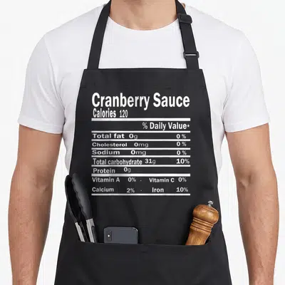 Sauce nutrition costume thanksgiving apron - White typography listing calories and nutrients in a stacked nutrition — shown on a black cotton canvas apron against a white background
