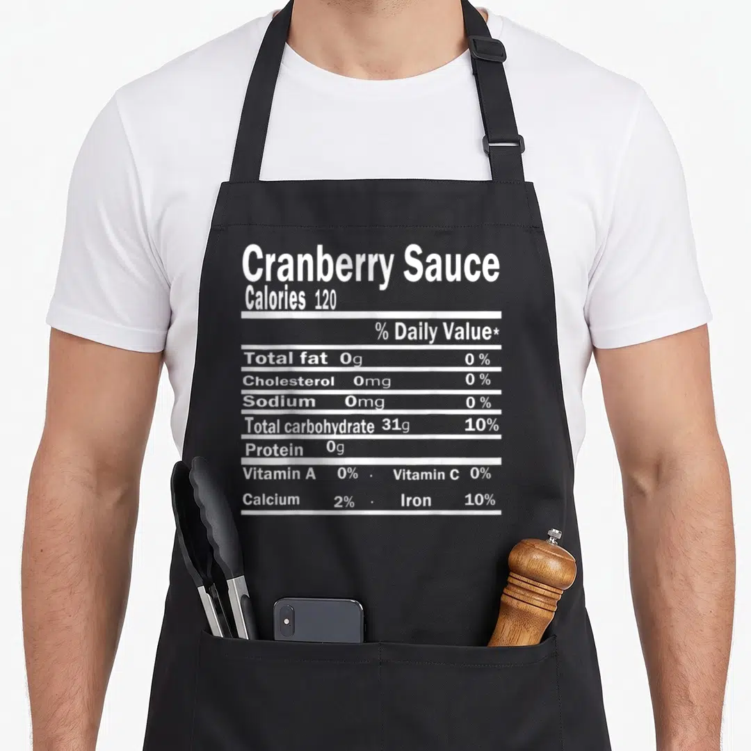 Sauce nutrition costume thanksgiving apron - White typography listing calories and nutrients in a stacked nutrition — shown on a black cotton canvas apron against a white background