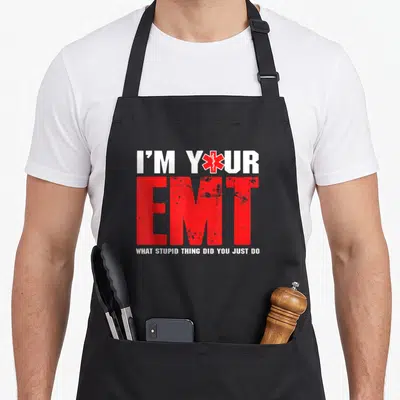 Paramedic ambulance guy apron - Red and white text I'M YOUR EMT with Star of Life symbol replacing the O in YOUR — shown on a black cotton canvas apron against a white background