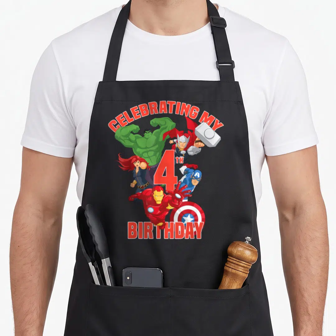 Celebrating 4th birthday apron - Avengers characters surrounding a large red number four with celebratory text — shown on a black cotton canvas apron against a white background