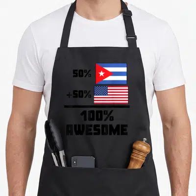 Vintage cuban american flag apron - Two stacked flags with 50 percent plus 50 percent equals 100 percent Awesome text — shown on a black cotton canvas apron against a white background
