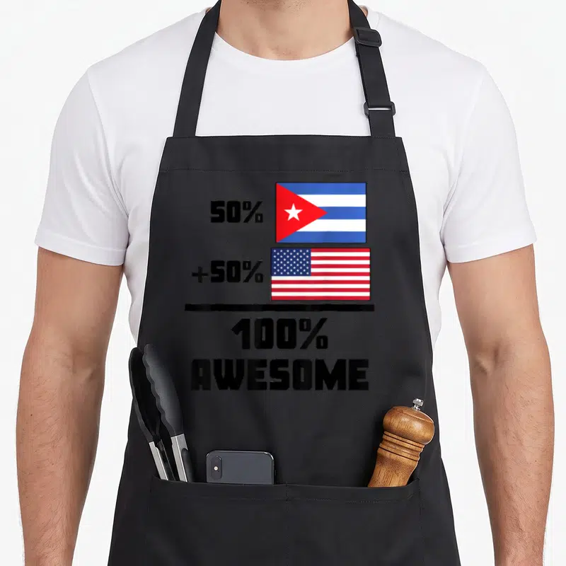 Vintage cuban american flag apron - Two stacked flags with 50 percent plus 50 percent equals 100 percent Awesome text — shown on a black cotton canvas apron against a white background