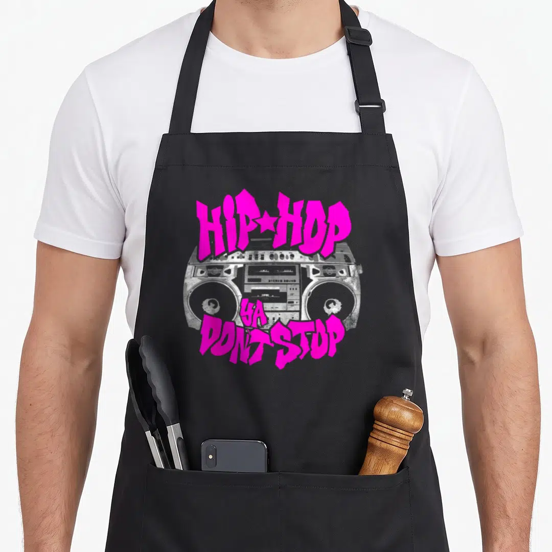 Stop hip aprons - Pink graffiti text HIP HOP YA DON T STOP over grey cartoon boombox on black fabric — shown on a black cotton canvas apron against a white background