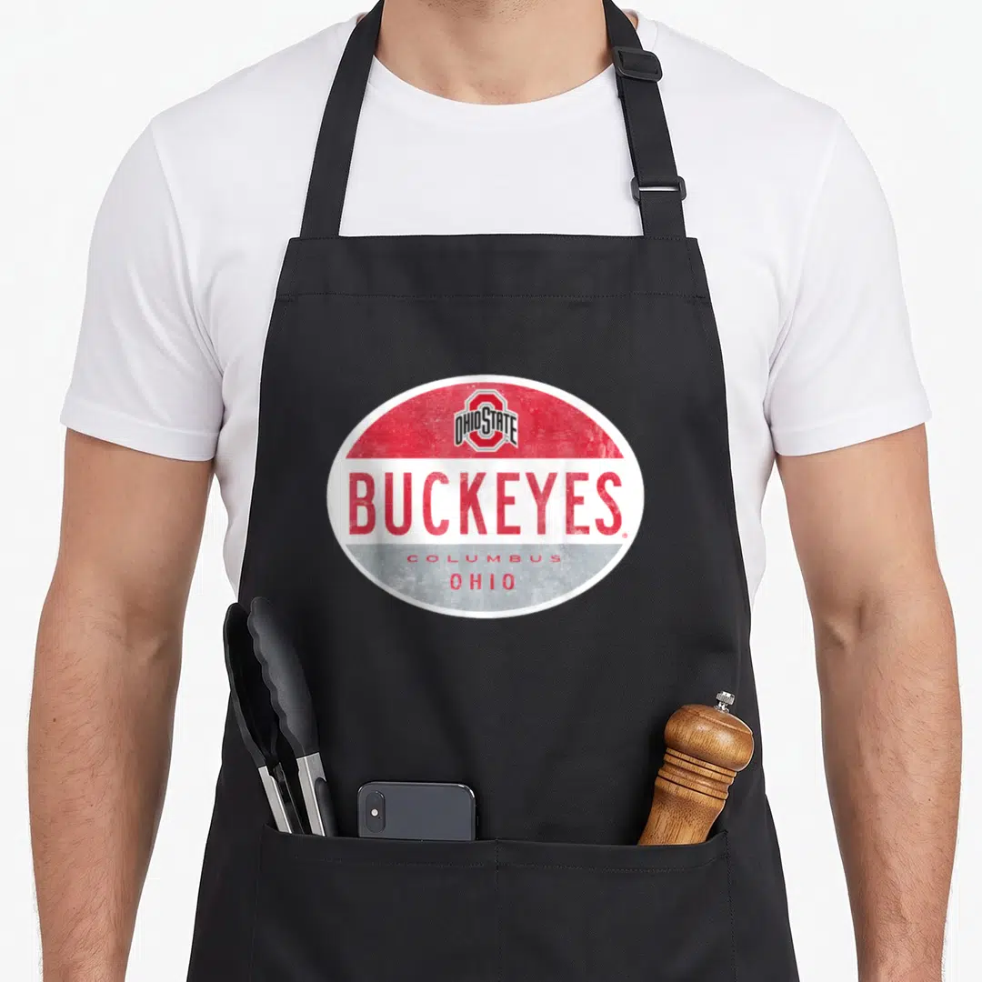 Oval canton ohio apron - Retro oval logo with red white grey bands and Buckeyes Columbus Ohio text — shown on a black cotton canvas apron against a white background