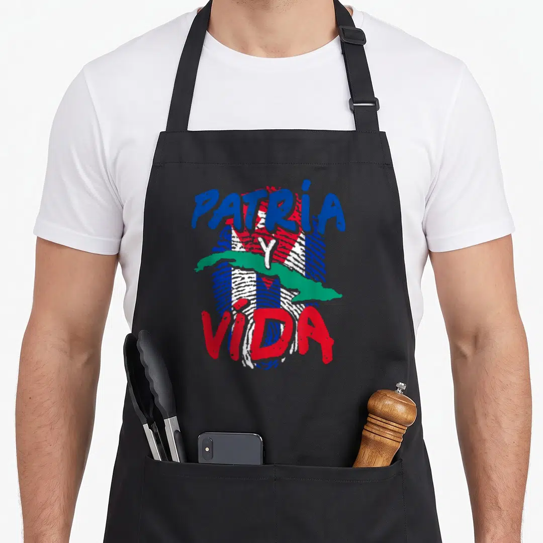 Acabo freedom of movement apron - Patria Y Vida Dominican flag fingerprint art with green map and watercolor text — shown on a black cotton canvas apron against a white background