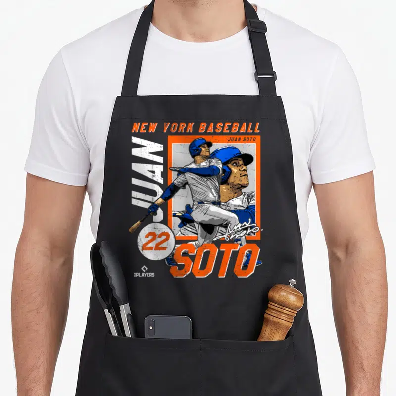 Juan new york apron - Orange and blue cartoon baseball player with vertical JUAN text and number 22 circle — shown on a black cotton canvas apron against a white background