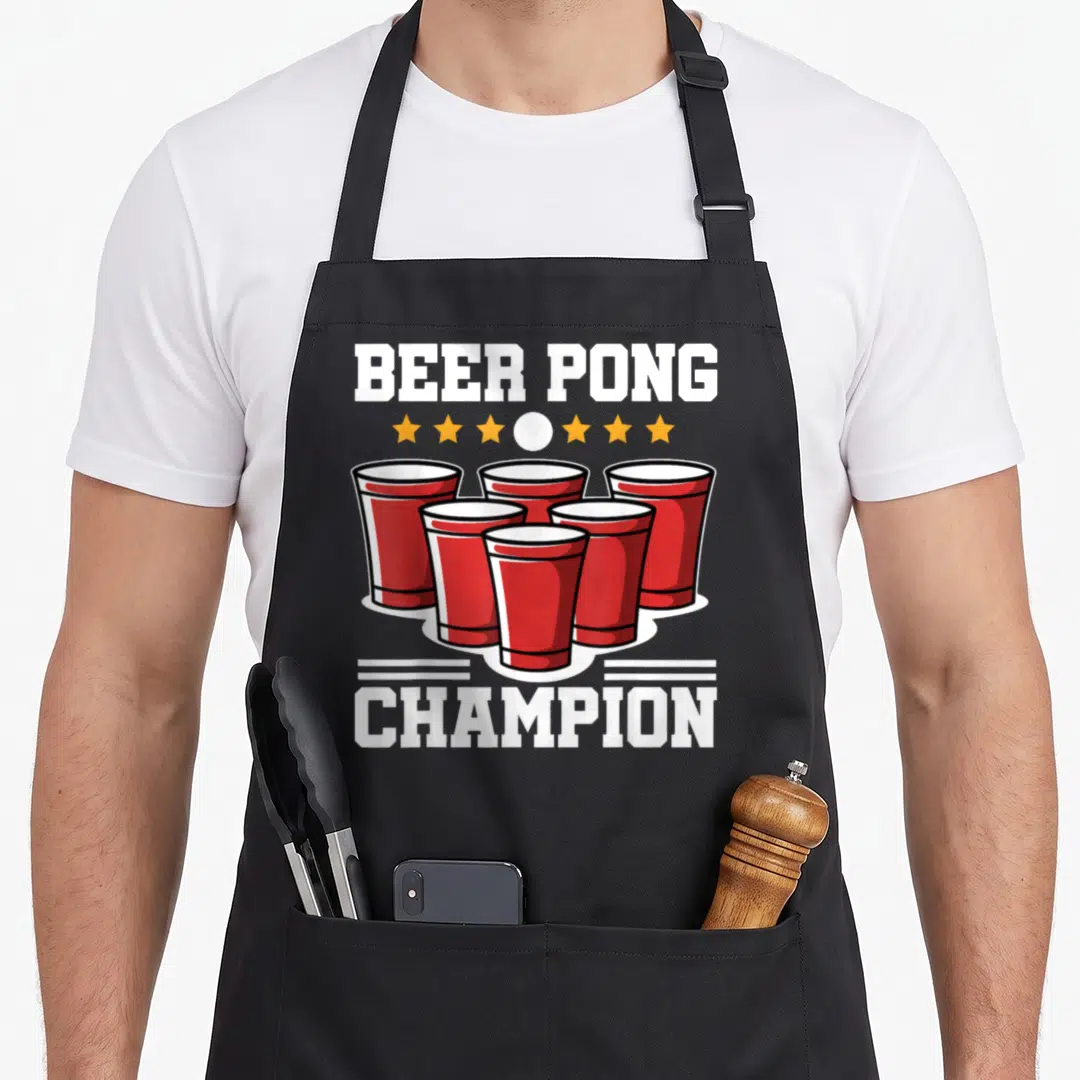 Alcohol beer pong apron - Red cups triangle formation with Beer Pong Champion text and stars — shown on a black cotton canvas apron against a white background