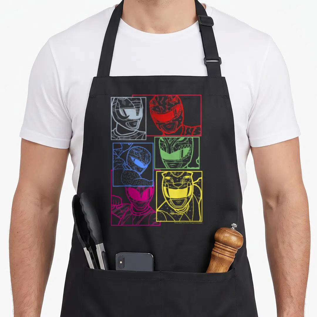 Shot line apron - Five Power Ranger line-art portraits in white, red, blue, green, pink, and yellow square frames — shown on a black cotton canvas apron against a white background
