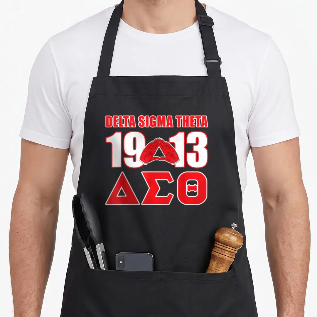 Sigma theta paraphernalia hbcu sorority apron - Red and white hands forming triangle between 1913 numbers with Delta — shown on a black cotton canvas apron against a white background