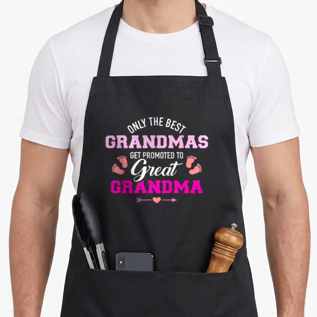Grandmas grandma apron - Stacked text reading Only The Best Grandmas Get Promoted To Great Grandma with baby footprints — shown on a black cotton canvas apron against a white background