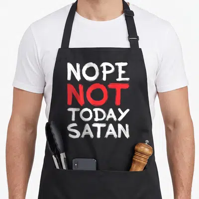 Nope today christian apron - Stacked white and red brush font reading NOPE NOT TODAY SATAN — shown on a black cotton canvas apron against a white background